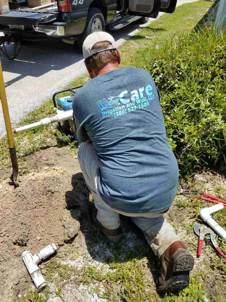 WaterCare service truck on site for a residential irrigation pipe repair