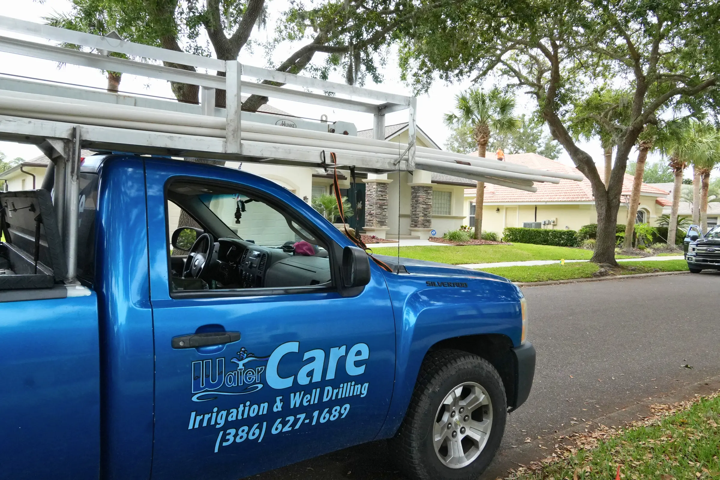 WaterCare service truck with company logo parked at a Northeast Florida customer home